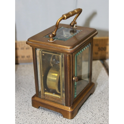 1336 - An antique carriage clock in leather travelling case, made in France but retailed by the Goldsmiths ... 