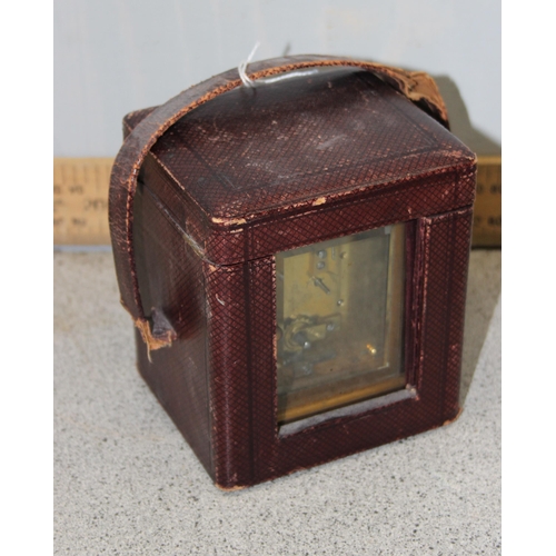 1336 - An antique carriage clock in leather travelling case, made in France but retailed by the Goldsmiths ... 