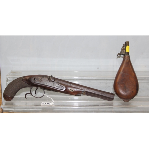 1412 - H. Nock 19th century percussion cap pistol with wooden handle and a leather shot flask