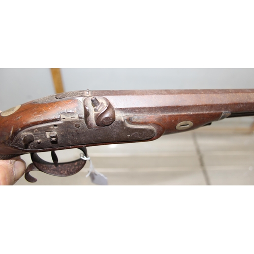 1412 - H. Nock 19th century percussion cap pistol with wooden handle and a leather shot flask