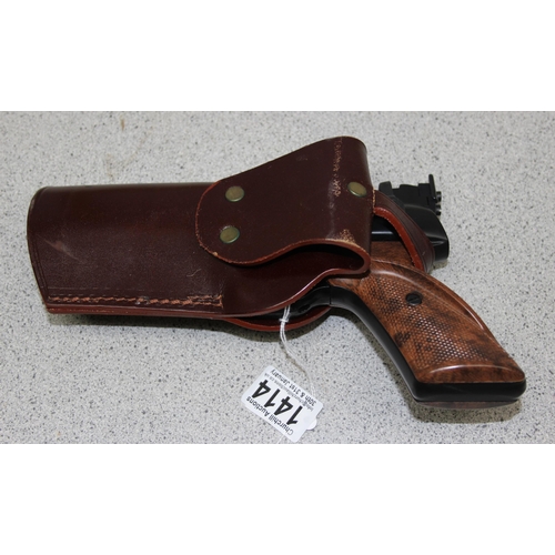 1414 - Webley Tempest .22 air pistol in leather holster, with a tin of pellets