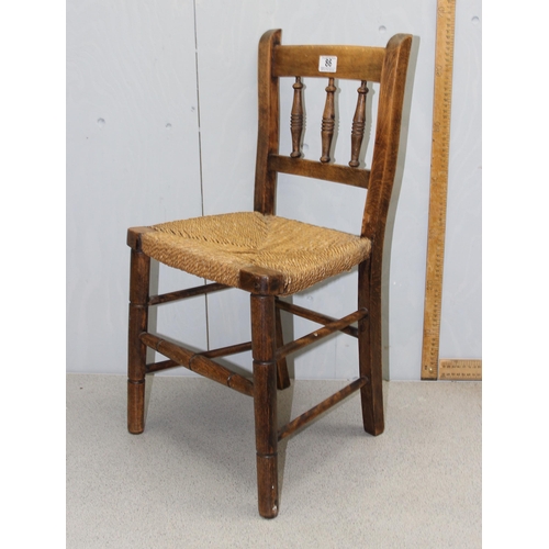 86 - An Arts & Crafts period rush seated child's chair