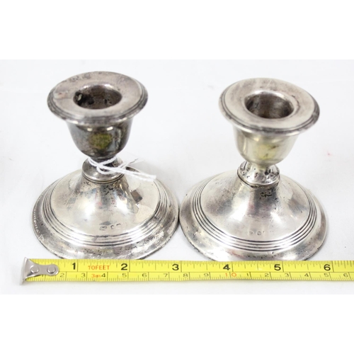 1043 - A pair of sterling silver dwarf candlesticks, weighted, English but hallmarks rubbed, likely Birming... 