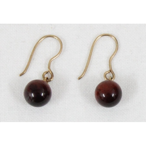 1102 - A pair of 9ct gold and Tiger's Eye drop earrings, marked 9k but XRF confirmed