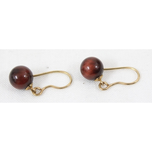 1102 - A pair of 9ct gold and Tiger's Eye drop earrings, marked 9k but XRF confirmed