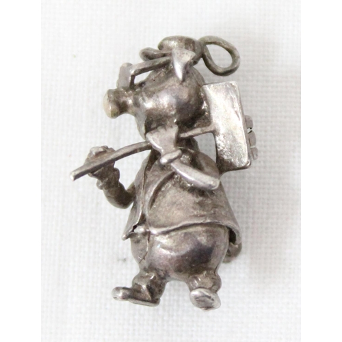 1104 - A small silver pendant or charm formed as a pig hod carrier