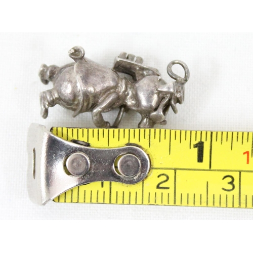 1104 - A small silver pendant or charm formed as a pig hod carrier