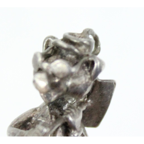 1104 - A small silver pendant or charm formed as a pig hod carrier