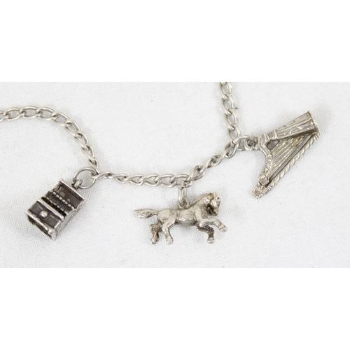 1105 - 2 vintage silver charm bracelets and charms