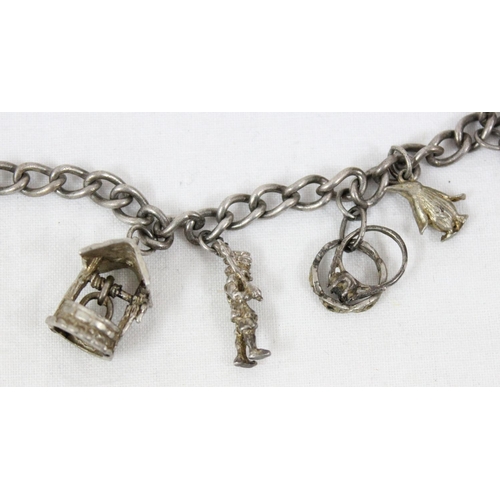 1105 - 2 vintage silver charm bracelets and charms