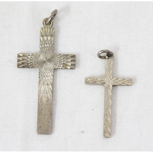 1106 - 4 assorted silver crucifix pendants