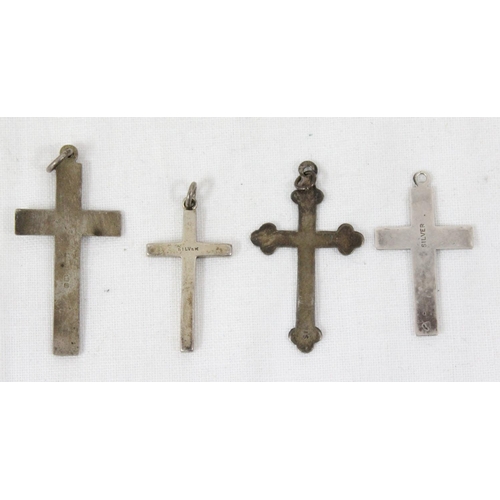 1106 - 4 assorted silver crucifix pendants