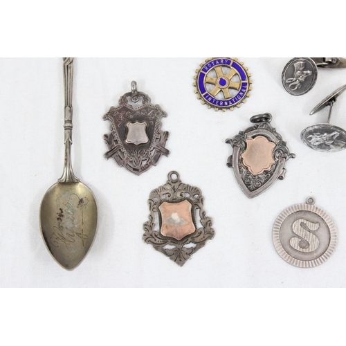 1111 - Qty of assorted silver fobs, 2 pairs of silver cuff links and a French .800 silver spoon, gross weig... 