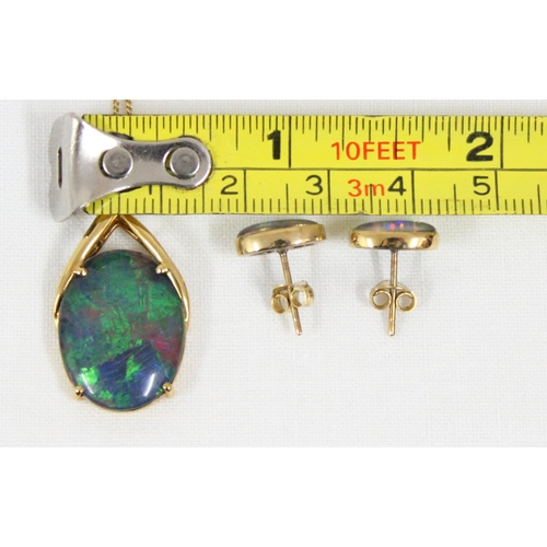 1114 - An 18ct gold mounted black opal triplet set comprising of a pendant on an Italian 18ct gold chain an... 