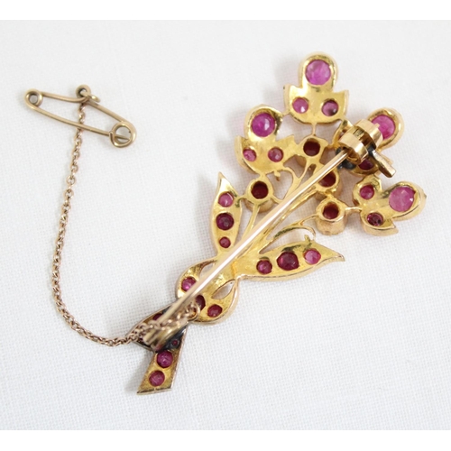 1116 - An antique 14ct gold and ruby set brooch formed as a floral spray, the largest ruby approx 5mm in di... 