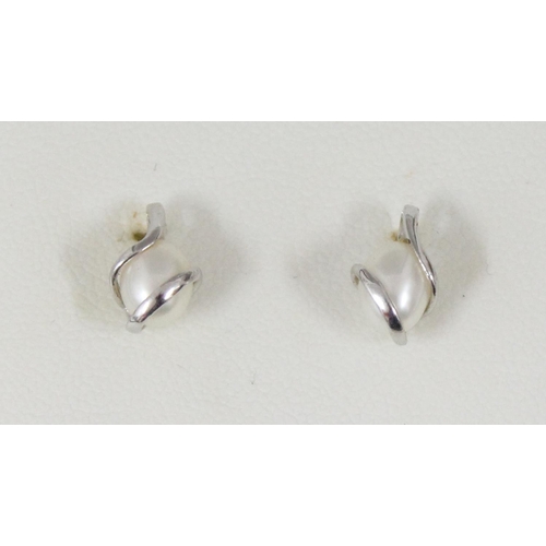 1122 - A pair of 9ct white gold and pearl earrings in original box