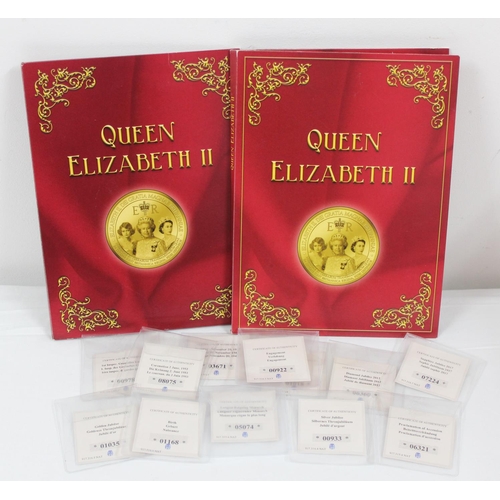 1271 - 2 folders of Queen Elizabeth II commemorative gold plated on copper medallions with paperwork