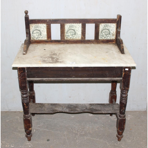 81 - A 19th century stained pine washstand with marble top and tile back, approx 92cm wide