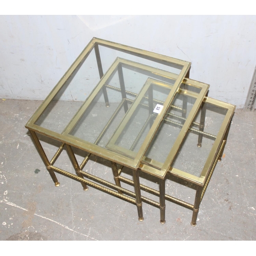 85 - A vintage nest of 3 brass tables with glass tops and twisted column supports