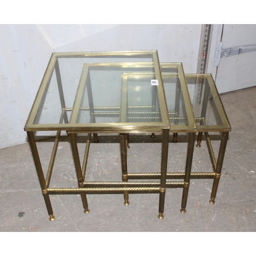 85 - A vintage nest of 3 brass tables with glass tops and twisted column supports