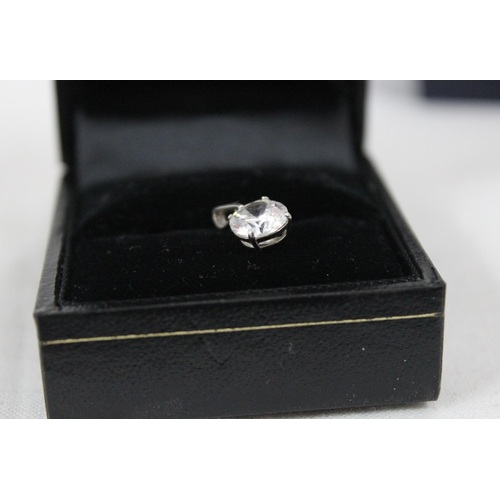 1149 - 9ct white gold mounted solitaire white stone pendant, approx 0.71g gross