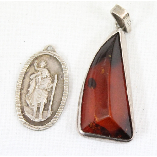 1150 - 3 silver pendants, 2 St Christopher & silver mounted amber