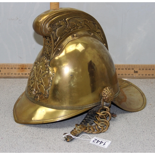 1442 - An antique brass fireman's helmet, believed to be Merryweather patent with embossed brass dragons an... 