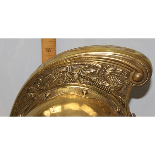 1442 - An antique brass fireman's helmet, believed to be Merryweather patent with embossed brass dragons an... 