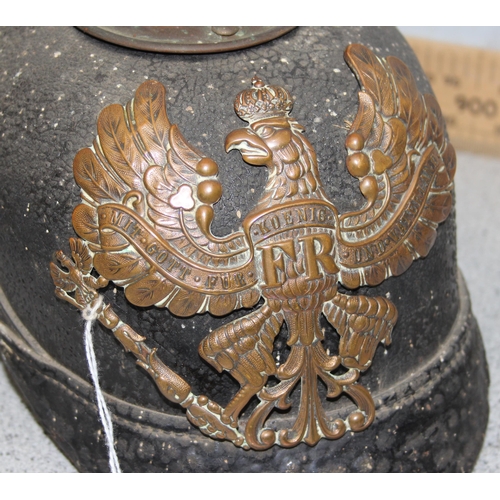 1443 - An original WW1 period German Pickelhaube helmet on leather and brass construction with liner and ea... 