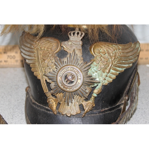 1444 - A late 19th or early 20th century Prussian Pickelhaube helmet with hair crest, the front adorned wit... 