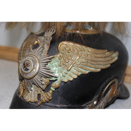 1444 - A late 19th or early 20th century Prussian Pickelhaube helmet with hair crest, the front adorned wit... 