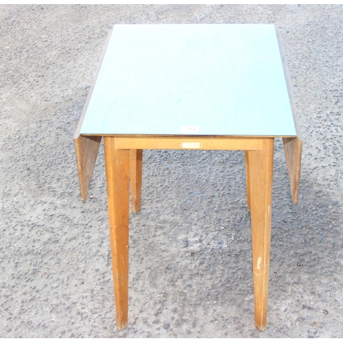 164 - Mid century green Formica drop leaf dining table by Kitchen Glory. Measures with leaf's up approx 90... 