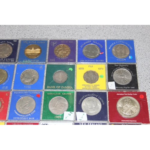 1189 - 36 assorted cased commemorative coins and medallions, various world coins, mainly British colonial