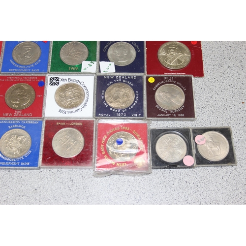 1189 - 36 assorted cased commemorative coins and medallions, various world coins, mainly British colonial