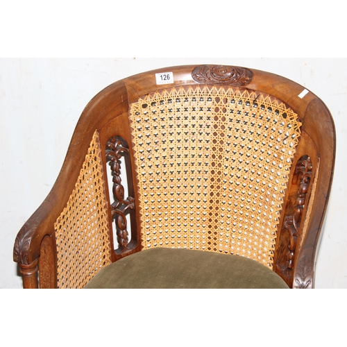 126 - A pair of vintage carved wooden and Bergere horseshoe chairs or tub chairs