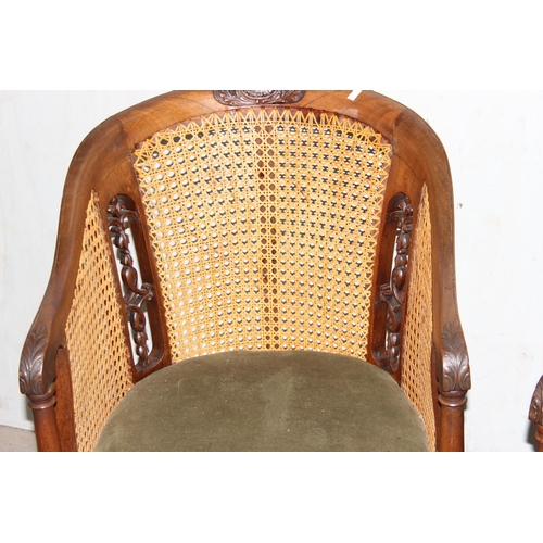 126 - A pair of vintage carved wooden and Bergere horseshoe chairs or tub chairs