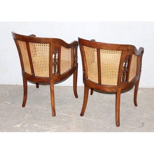 126 - A pair of vintage carved wooden and Bergere horseshoe chairs or tub chairs