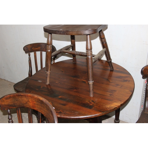 127 - A set of 4 stained pine or beech farmhouse kitchen chairs and a small round table, approx 92cm in di... 