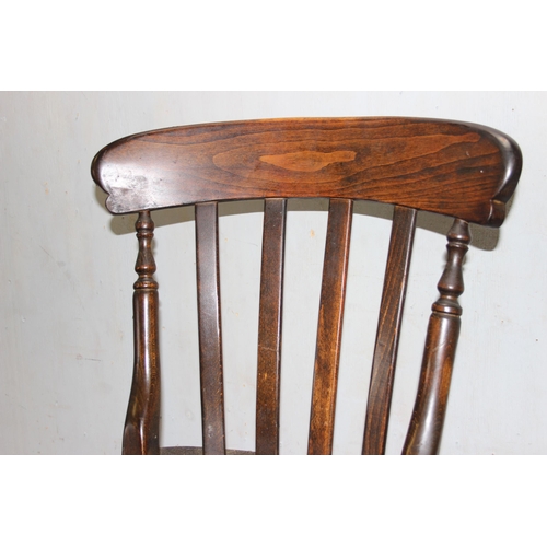 127 - A set of 4 stained pine or beech farmhouse kitchen chairs and a small round table, approx 92cm in di... 