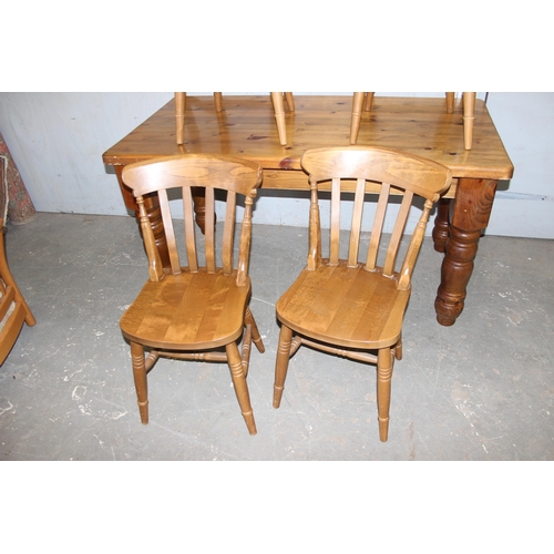 128 - A large pine farmhouse dining table and 4 farmhouse kitchen chairs, the table approx 153cm x 77cm