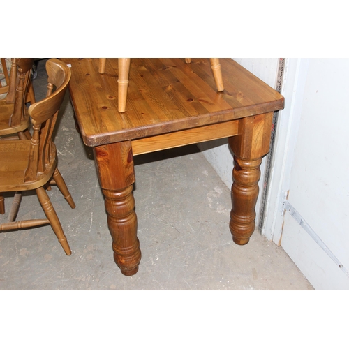 128 - A large pine farmhouse dining table and 4 farmhouse kitchen chairs, the table approx 153cm x 77cm