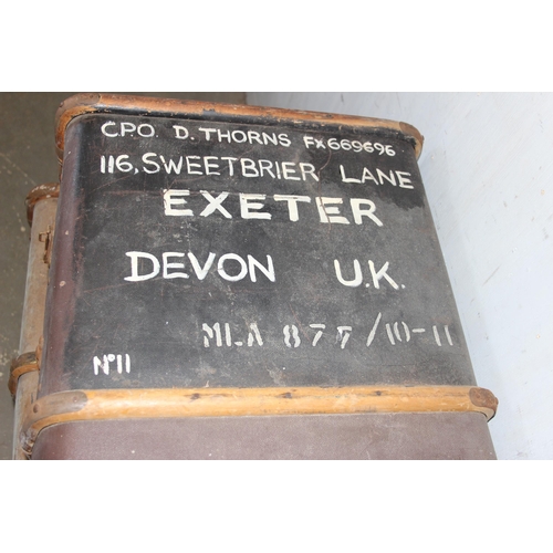 139 - 4 early 20th century canvas and wooden shipping trunks, some with writing