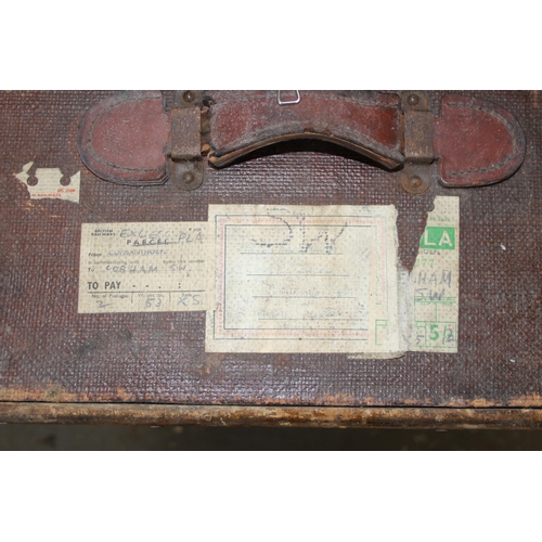 139 - 4 early 20th century canvas and wooden shipping trunks, some with writing