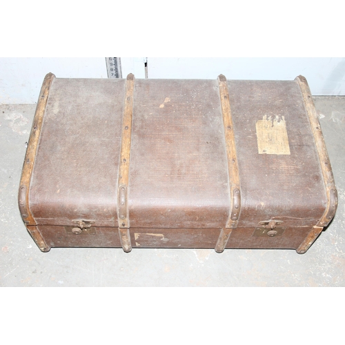 139 - 4 early 20th century canvas and wooden shipping trunks, some with writing