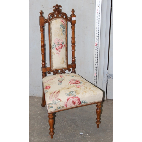 153 - An antique low fruitwood chair with floral upholstered seat