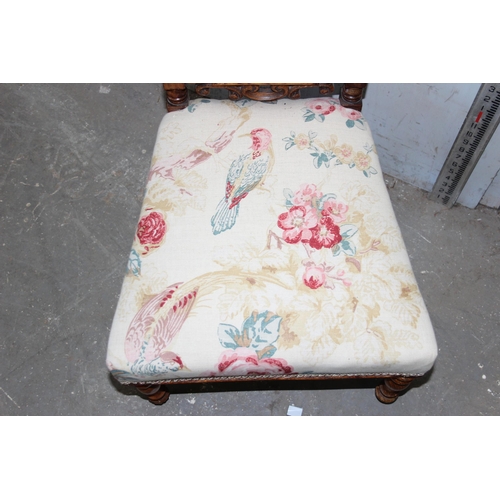 153 - An antique low fruitwood chair with floral upholstered seat