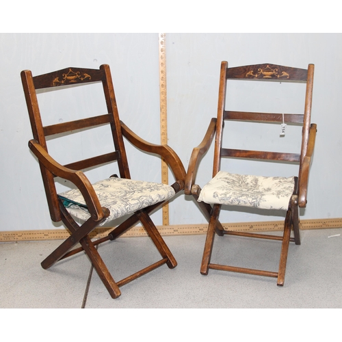 154 - A pair of vintage folding wooden children's chairs with inlaid classical decoration