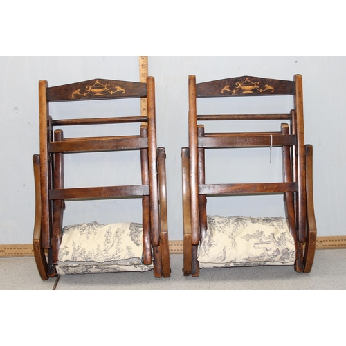 154 - A pair of vintage folding wooden children's chairs with inlaid classical decoration