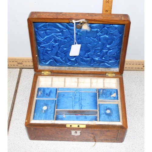 276 - An antique walnut inlaid sewing box with fitted interior