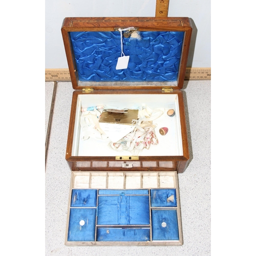 276 - An antique walnut inlaid sewing box with fitted interior